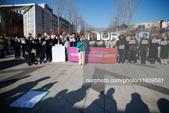 A group of dozens of current students and alumni from Yonsei University holds a press conference condemning President Yoon Suk-yeol's martia...