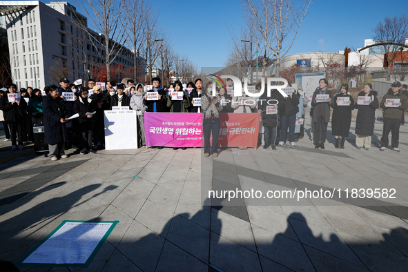 A group of dozens of current students and alumni from Yonsei University holds a press conference condemning President Yoon Suk-yeol's martia...