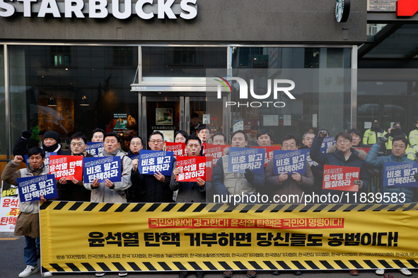 A coalition of 11 media organizations, including the National Union of Media Workers, holds a press conference in front of the People Power...