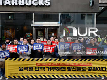 A coalition of 11 media organizations, including the National Union of Media Workers, holds a press conference in front of the People Power...