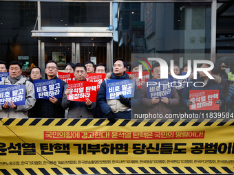 A coalition of 11 media organizations, including the National Union of Media Workers, holds a press conference in front of the People Power...