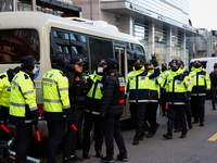 Police set up barricades in front of the People Power Party headquarters, the site of a rally by 11 media organizations, including the Natio...