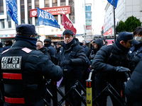 Police set up barricades in front of the People Power Party headquarters, the site of a rally by 11 media organizations, including the Natio...