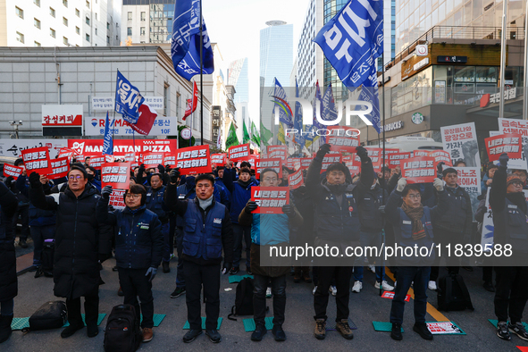 Over a hundred participants hold placards and chant slogans during the Immediate Impeachment of Traitor Yoon Suk-yeol Condemn the People Pow...