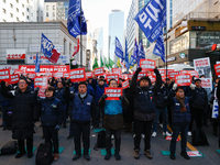 Over a hundred participants hold placards and chant slogans during the Immediate Impeachment of Traitor Yoon Suk-yeol Condemn the People Pow...