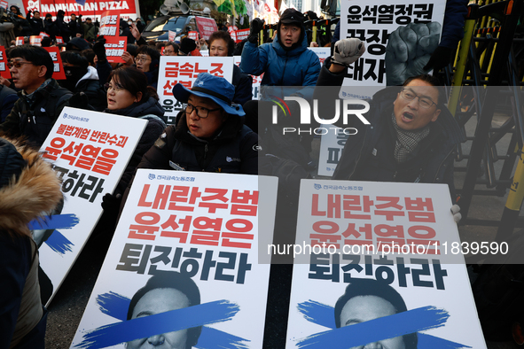 Over a hundred participants hold placards and chant slogans during the Immediate Impeachment of Traitor Yoon Suk-yeol Condemn the People Pow...