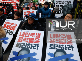 Over a hundred participants hold placards and chant slogans during the Immediate Impeachment of Traitor Yoon Suk-yeol Condemn the People Pow...