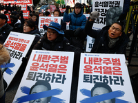 Over a hundred participants hold placards and chant slogans during the Immediate Impeachment of Traitor Yoon Suk-yeol Condemn the People Pow...