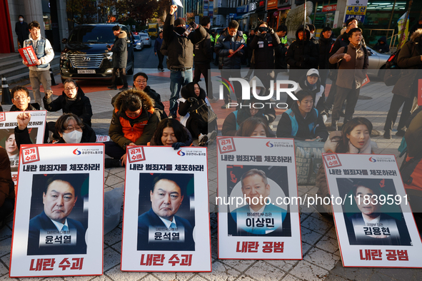 Over a hundred participants hold placards and chant slogans during the Immediate Impeachment of Traitor Yoon Suk-yeol Condemn the People Pow...