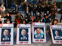 Over a hundred participants hold placards and chant slogans during the Immediate Impeachment of Traitor Yoon Suk-yeol Condemn the People Pow...