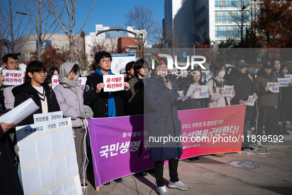 A group of dozens of current students and alumni from Yonsei University holds a press conference condemning President Yoon Suk-yeol's martia...