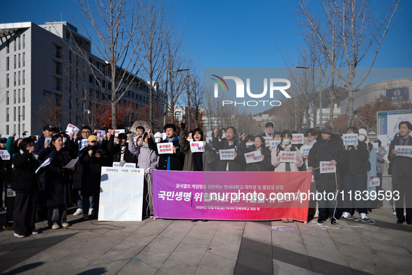 A group of dozens of current students and alumni from Yonsei University holds a press conference condemning President Yoon Suk-yeol's martia...