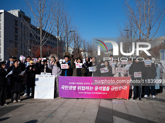 A group of dozens of current students and alumni from Yonsei University holds a press conference condemning President Yoon Suk-yeol's martia...