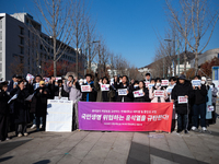 A group of dozens of current students and alumni from Yonsei University holds a press conference condemning President Yoon Suk-yeol's martia...