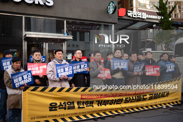 A coalition of 11 media organizations, including the National Union of Media Workers, holds a press conference in front of the People Power...