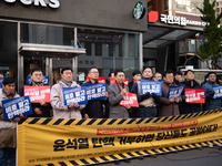 A coalition of 11 media organizations, including the National Union of Media Workers, holds a press conference in front of the People Power...