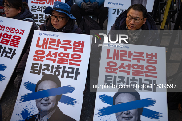 Over a hundred participants hold placards and chant slogans during the Immediate Impeachment of Traitor Yoon Suk-yeol Condemn the People Pow...