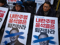 Over a hundred participants hold placards and chant slogans during the Immediate Impeachment of Traitor Yoon Suk-yeol Condemn the People Pow...