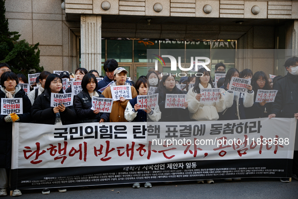 University students hold a protest in front of the People's Power Party headquarters in Seoul, South Korea, on December 6, 2024, condemning...