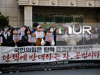 University students hold a protest in front of the People's Power Party headquarters in Seoul, South Korea, on December 6, 2024, condemning...