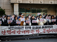 University students hold a protest in front of the People's Power Party headquarters in Seoul, South Korea, on December 6, 2024, condemning...