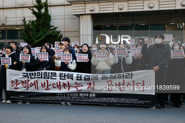 University students hold a protest in front of the People's Power Party headquarters in Seoul, South Korea, on December 6, 2024, condemning...