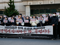 University students hold a protest in front of the People's Power Party headquarters in Seoul, South Korea, on December 6, 2024, condemning...