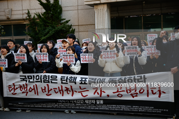 University students hold a protest in front of the People's Power Party headquarters in Seoul, South Korea, on December 6, 2024, condemning...