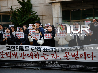 University students hold a protest in front of the People's Power Party headquarters in Seoul, South Korea, on December 6, 2024, condemning...