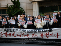 University students hold a protest in front of the People's Power Party headquarters in Seoul, South Korea, on December 6, 2024, condemning...