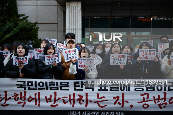 University students hold a protest in front of the People's Power Party headquarters in Seoul, South Korea, on December 6, 2024, condemning...