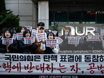 University students hold a protest in front of the People's Power Party headquarters in Seoul, South Korea, on December 6, 2024, condemning...