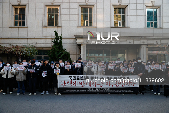 University students hold a protest in front of the People's Power Party headquarters in Seoul, South Korea, on December 6, 2024, condemning...