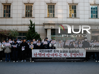 University students hold a protest in front of the People's Power Party headquarters in Seoul, South Korea, on December 6, 2024, condemning...