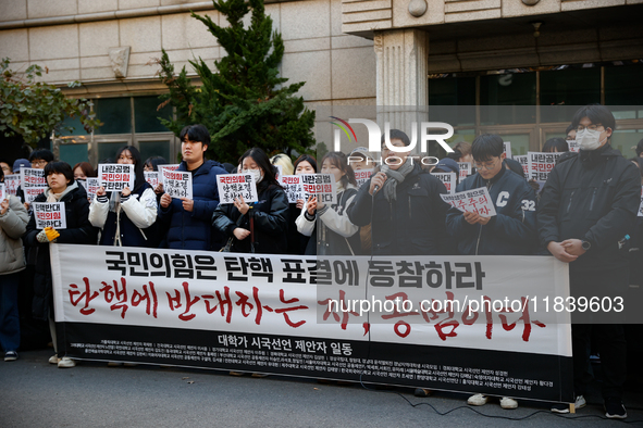 University students hold a protest in front of the People's Power Party headquarters in Seoul, South Korea, on December 6, 2024, condemning...