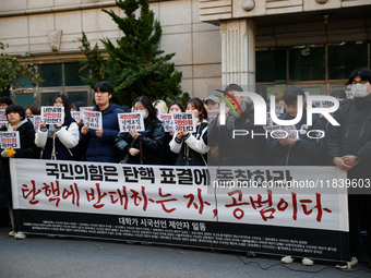 University students hold a protest in front of the People's Power Party headquarters in Seoul, South Korea, on December 6, 2024, condemning...