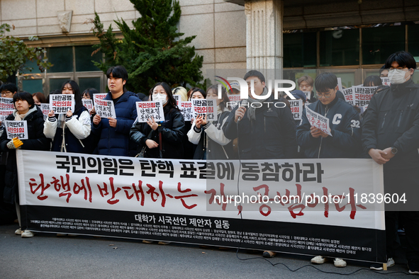 University students hold a protest in front of the People's Power Party headquarters in Seoul, South Korea, on December 6, 2024, condemning...