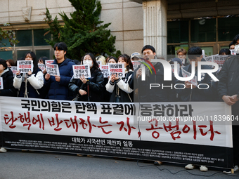 University students hold a protest in front of the People's Power Party headquarters in Seoul, South Korea, on December 6, 2024, condemning...