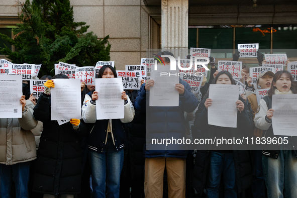 University students hold a protest in front of the People's Power Party headquarters in Seoul, South Korea, on December 6, 2024, condemning...