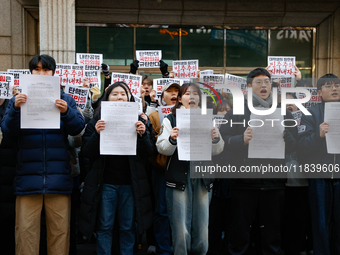 University students hold a protest in front of the People's Power Party headquarters in Seoul, South Korea, on December 6, 2024, condemning...