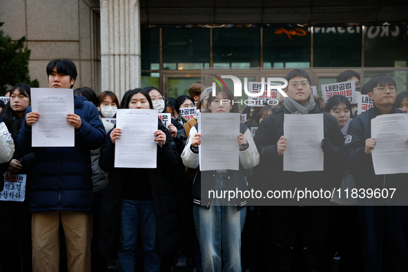 University students hold a protest in front of the People's Power Party headquarters in Seoul, South Korea, on December 6, 2024, condemning...