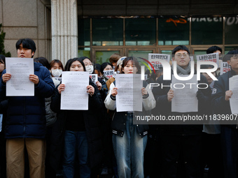 University students hold a protest in front of the People's Power Party headquarters in Seoul, South Korea, on December 6, 2024, condemning...