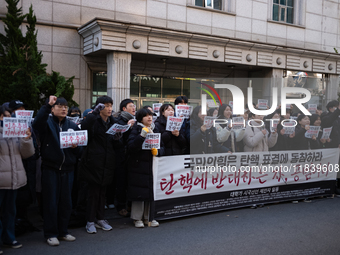 University students hold a protest in front of the People's Power Party headquarters in Seoul, South Korea, on December 6, 2024, condemning...