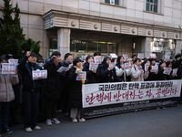 University students hold a protest in front of the People's Power Party headquarters in Seoul, South Korea, on December 6, 2024, condemning...