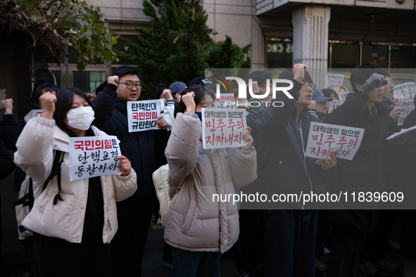 University students hold a protest in front of the People's Power Party headquarters in Seoul, South Korea, on December 6, 2024, condemning...