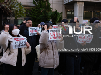 University students hold a protest in front of the People's Power Party headquarters in Seoul, South Korea, on December 6, 2024, condemning...