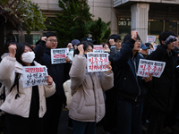 University students hold a protest in front of the People's Power Party headquarters in Seoul, South Korea, on December 6, 2024, condemning...