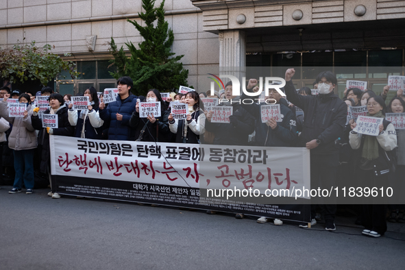 University students hold a protest in front of the People's Power Party headquarters in Seoul, South Korea, on December 6, 2024, condemning...