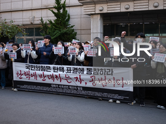 University students hold a protest in front of the People's Power Party headquarters in Seoul, South Korea, on December 6, 2024, condemning...