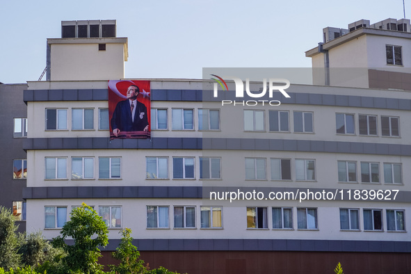 A portrait of Mustafa Kemal Ataturk hangs on the university building in Alanya, Turkey, on November 3, 2024. 